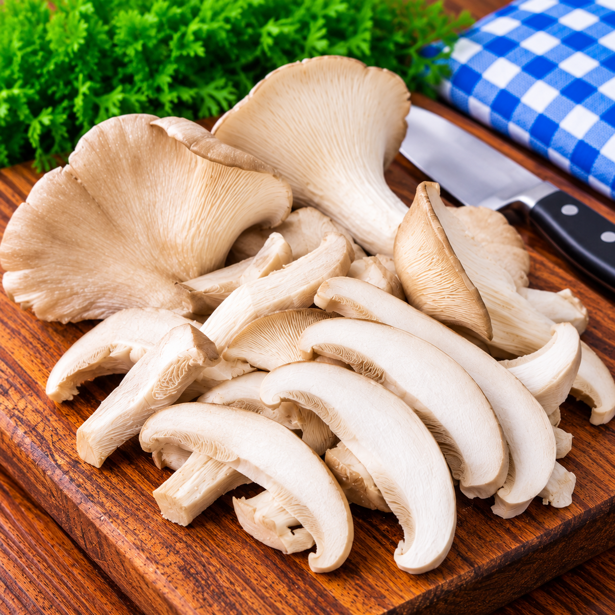 Fresh Gourmet Oyster Mushrooms whole and sliced ready for cooking