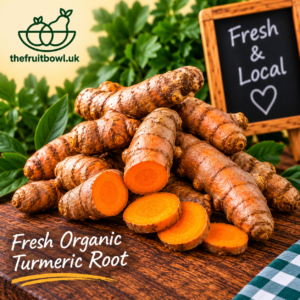 Fresh Organic Turmeric Root whole and sliced showing its vibrant orange flesh