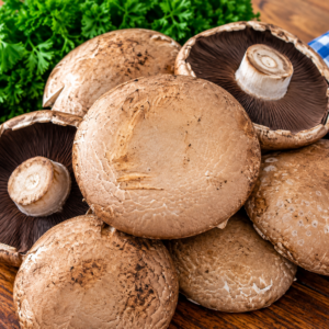 Fresh Portobello Mushrooms with large brown caps and dark gills