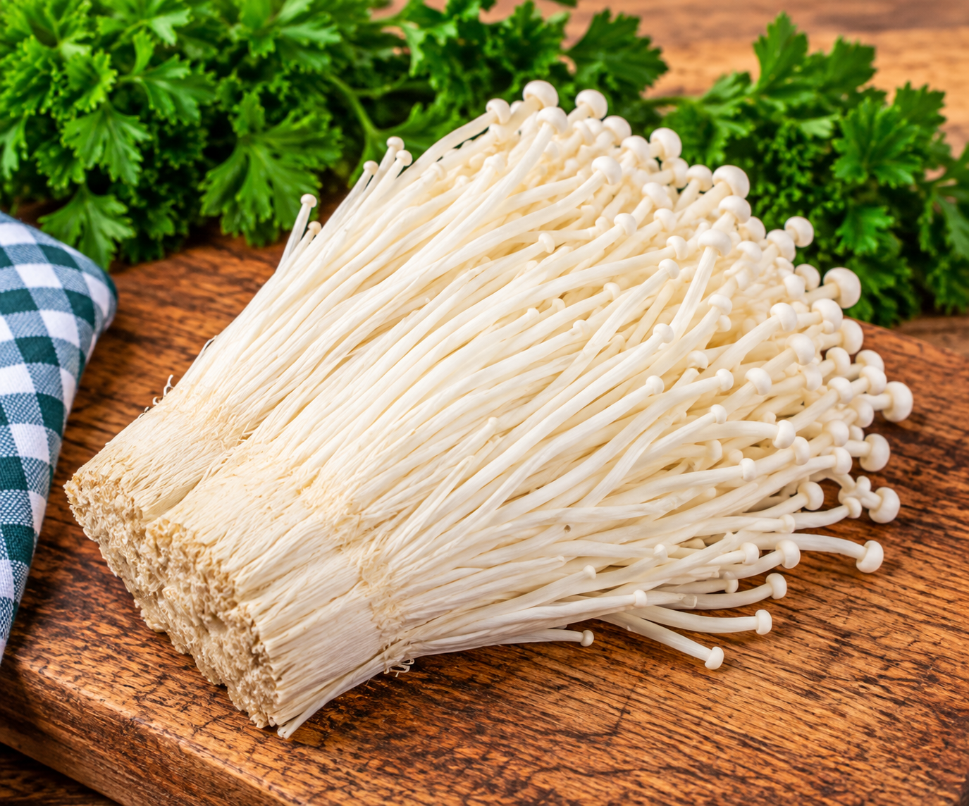 Fresh White Enoki Mushrooms with long slender stems and small white caps