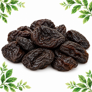 A pile of dark, wrinkled prunes on a white background with green leafy corners.